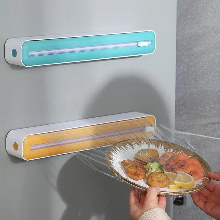 Versatile magnetic kitchen wrap dispenser with slide cutter for managing cling film, foil, and baking paper in a Kiwi kitchen