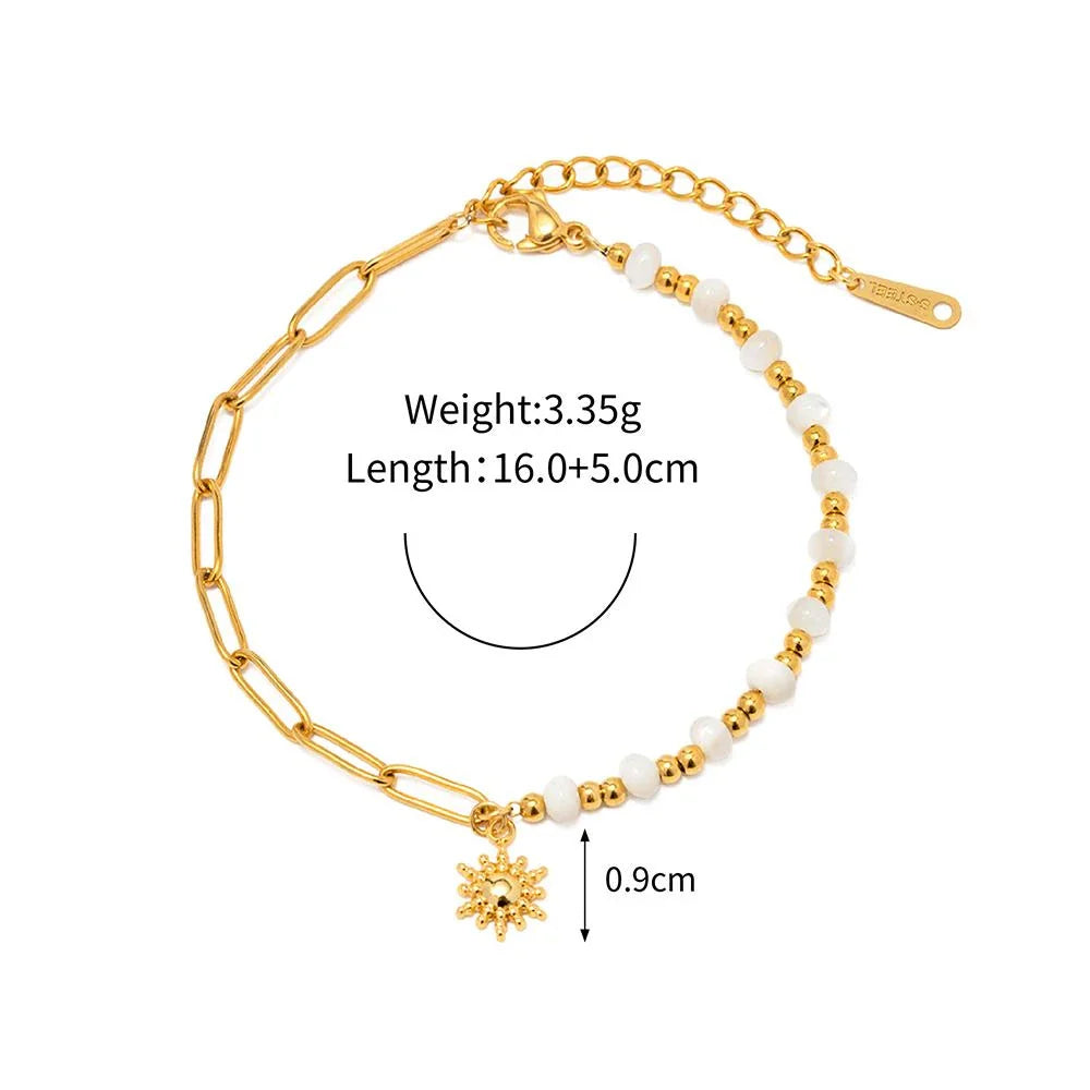 Stylish stainless steel sun pendant bracelet with a trendy paperclip chain and stitched beads, a versatile accessory for the modern Kiwi woman