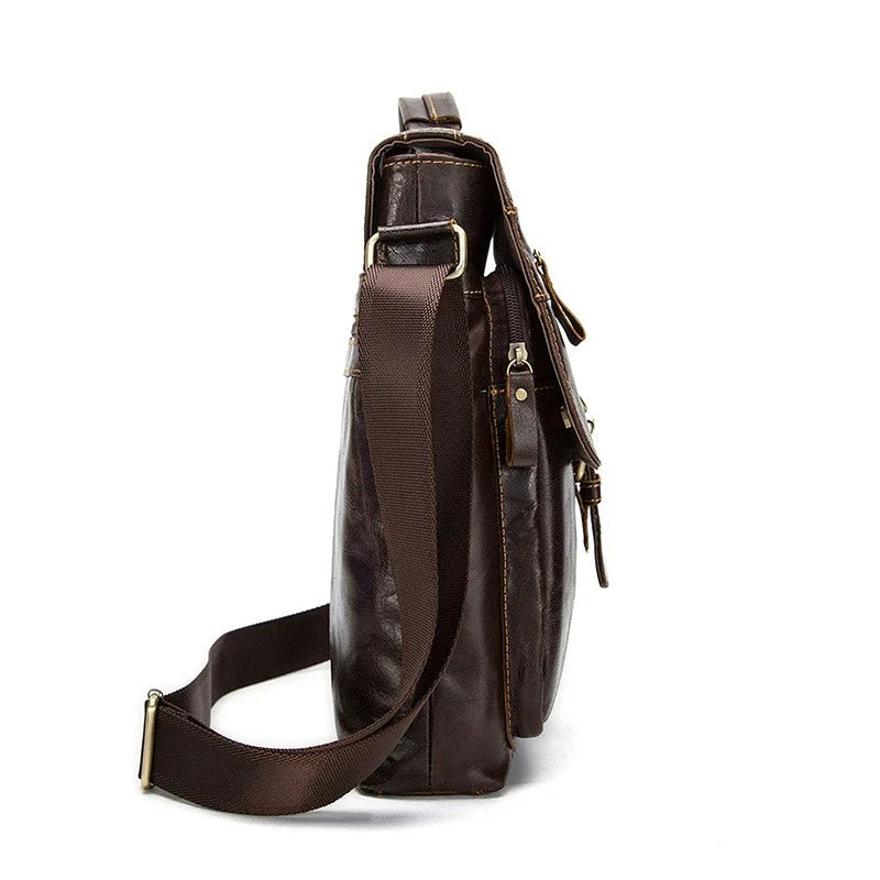 Premium retro-style messenger bag made from durable New Zealand cowhide with versatile interior organization and hands-free single strap design.