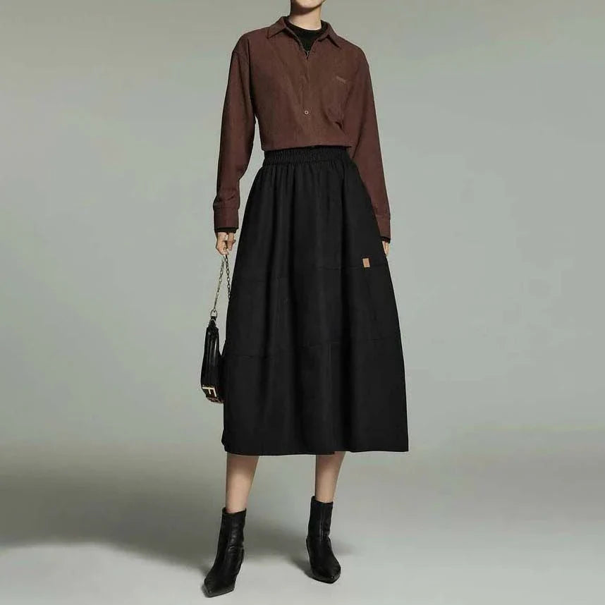 A stylish mid-length pleated skirt with pockets, perfect for winter wear in New Zealand