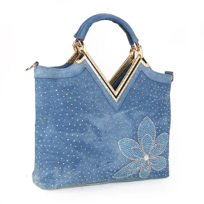 Light blue denim crossbody bag with a v-shaped diamond flower design, perfect for everyday use.