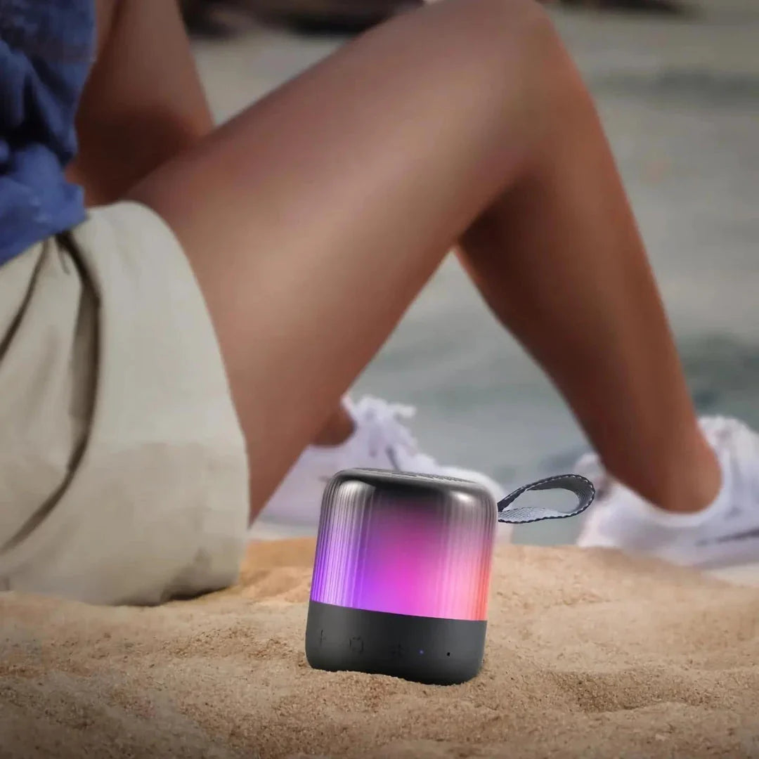 Glow Mini 360° surround sound portable speaker with synchronized light show for parties and outdoor activities