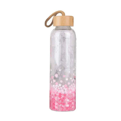 Vibrant glass water bottle with colourful print design and eco-friendly bamboo lid