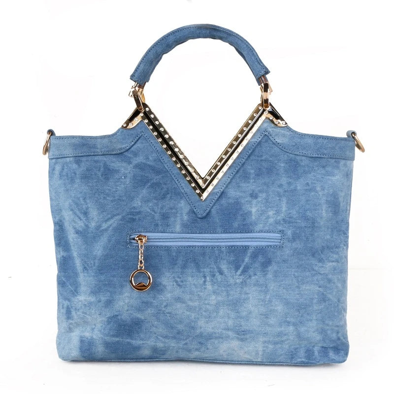 Light blue denim crossbody bag with a v-shaped diamond flower design, perfect for everyday use.