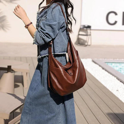 Timeless Kiwi Leather Crossbody Hobo Bag with Unique Stone Pattern Design and Adjustable Strap