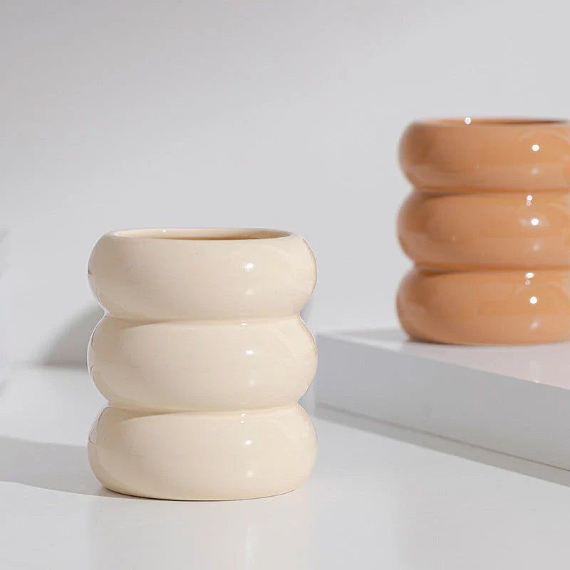 Nordic-inspired ceramic candle holder with a sleek, white finish and simple lines for elegant home decor