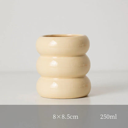 Nordic-inspired ceramic candle holder with a sleek, white finish and simple lines for elegant home decor