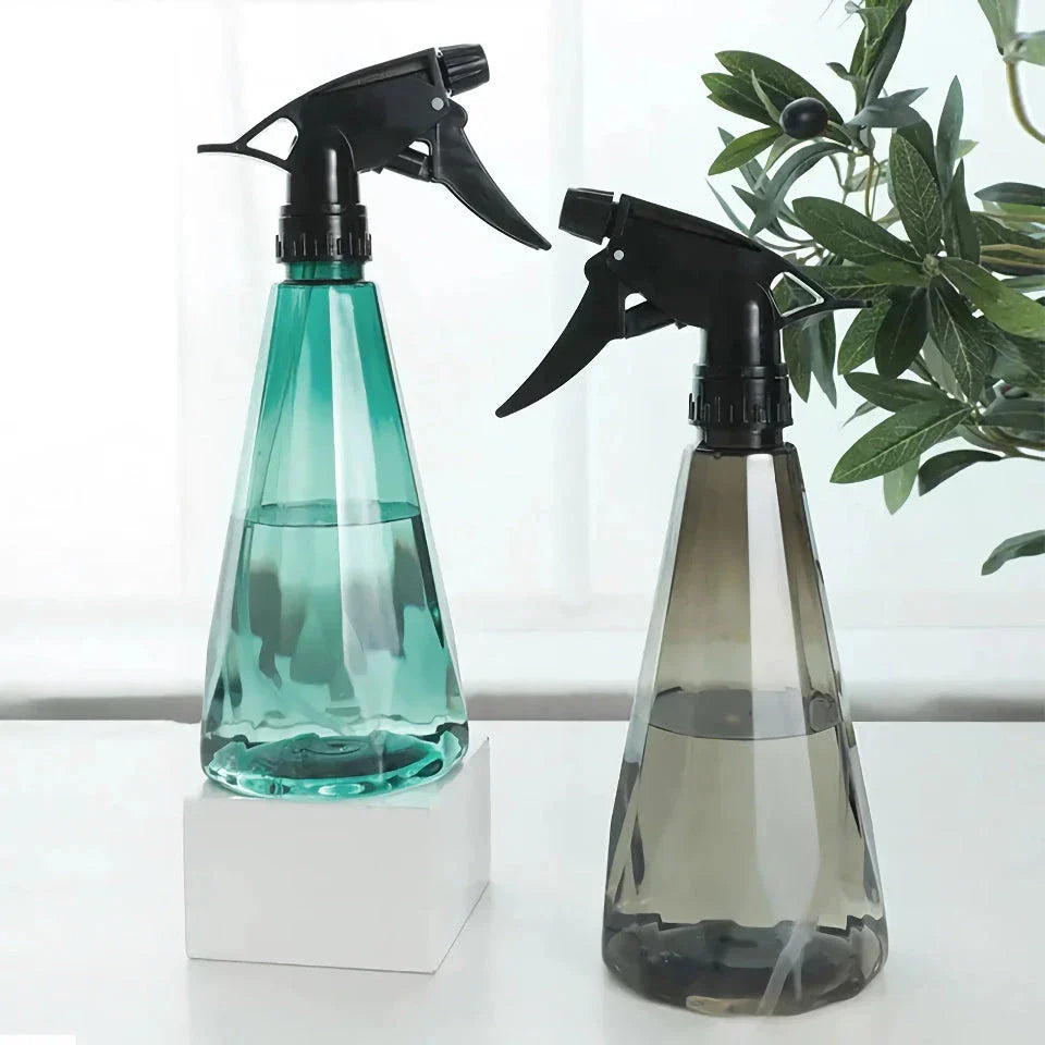 Versatile Sprinkler Spray Bottle with adjustable nozzle, durable construction, and transparent design for gardening and cleaning tasks.