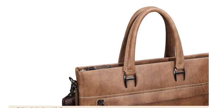 A stylish leather laptop bag featuring a classic Kiwi-inspired design, with a hidden zipper compartment, mobile phone pocket, and ID sleeve for optimal organization.