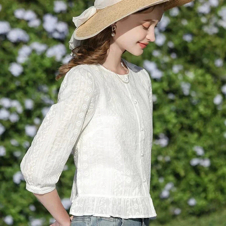 Elegant French-inspired white puff sleeve blouse with tailored fit and timeless design