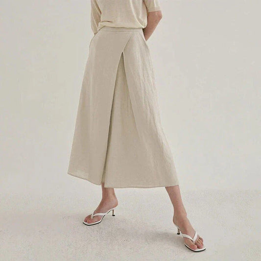 Stylish high-waisted cotton-linen wide-leg trousers in a neutral linen colour, perfect for the modern Kiwi woman's wardrobe.