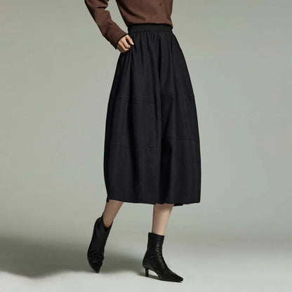 A stylish mid-length pleated skirt with pockets, perfect for winter wear in New Zealand