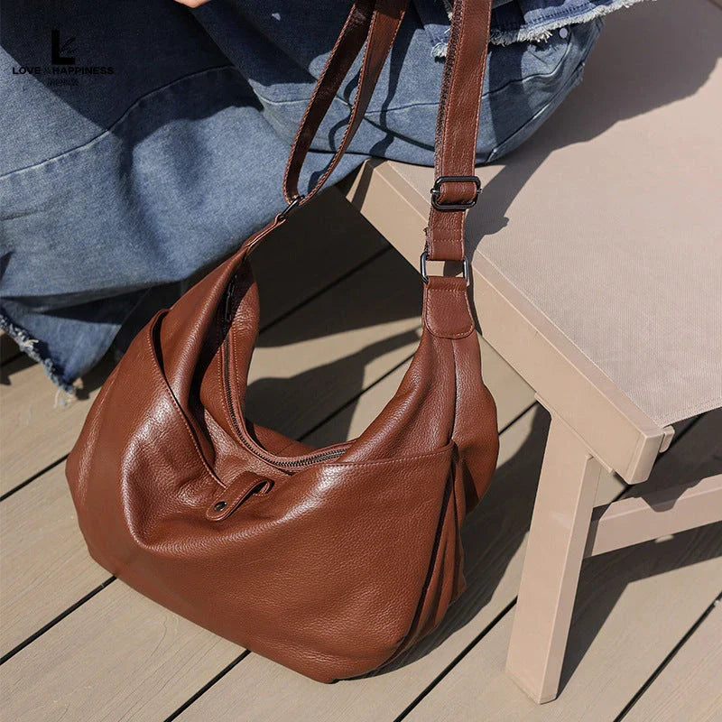 Timeless Kiwi Leather Crossbody Hobo Bag with Unique Stone Pattern Design and Adjustable Strap