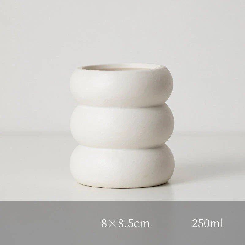 Nordic-inspired ceramic candle holder with a sleek, white finish and simple lines for elegant home decor