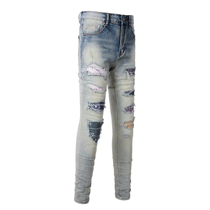 Stylish men's ripped jeans in light blue, featuring a unique distressed look and skinny-fit silhouette inspired by New Zealand's high-street fashion