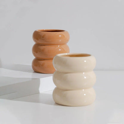 Nordic-inspired ceramic candle holder with a sleek, white finish and simple lines for elegant home decor