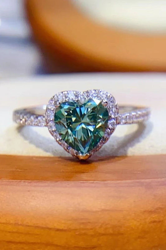 A stunning 1 carat moissanite heart-shaped ring crafted with 925 sterling silver, platinum plating, and zircon accents - a true testament to New Zealand's innovative spirit and timeless elegance.