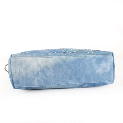 Light blue denim crossbody bag with a v-shaped diamond flower design, perfect for everyday use.