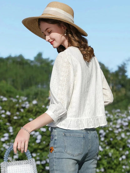 Elegant French-inspired white puff sleeve blouse with tailored fit and timeless design