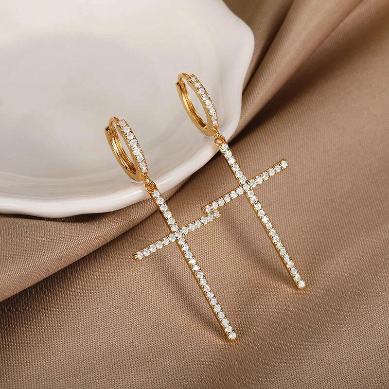 Elegant cross-shaped dangle earrings made with premium cubic zirconia and copper