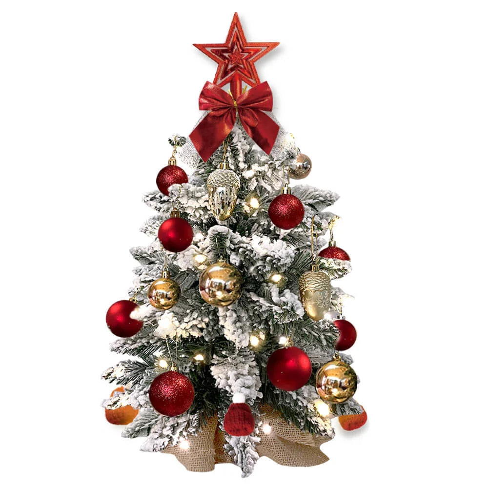 A 2ft mini Christmas tree with flocked snow design, lights, and ornaments for festive tabletop decoration in New Zealand homes and offices.