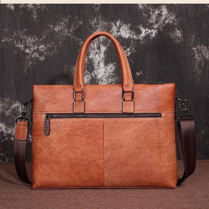 A stylish leather laptop bag featuring a classic Kiwi-inspired design, with a hidden zipper compartment, mobile phone pocket, and ID sleeve for optimal organization.