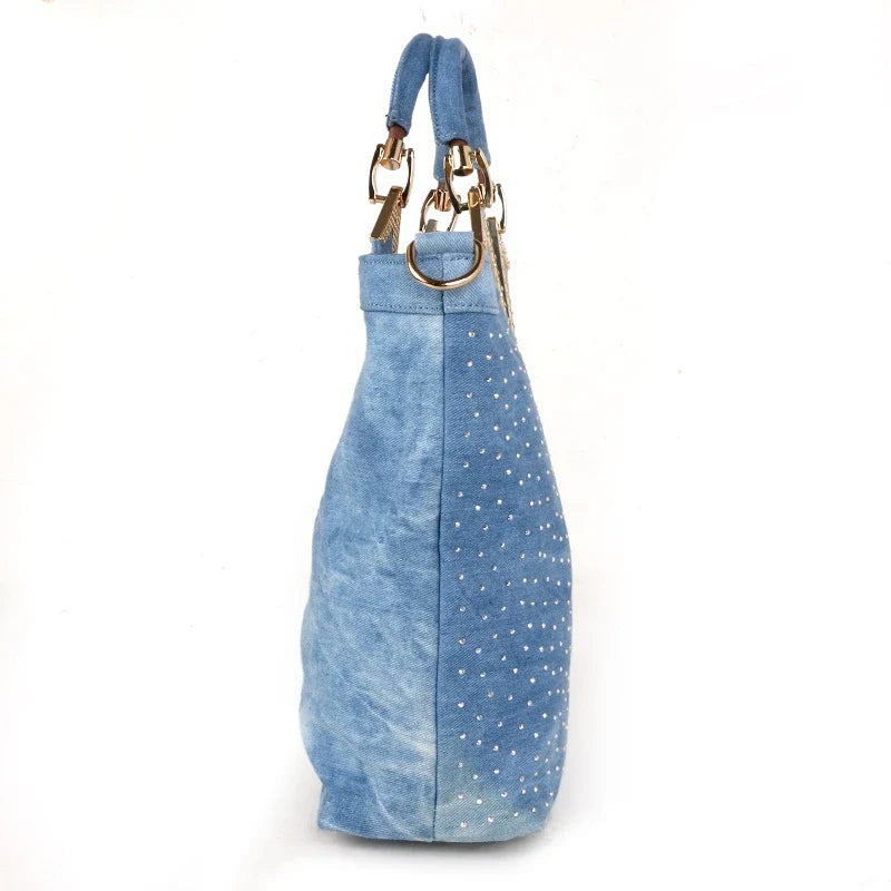 Light blue denim crossbody bag with a v-shaped diamond flower design, perfect for everyday use.