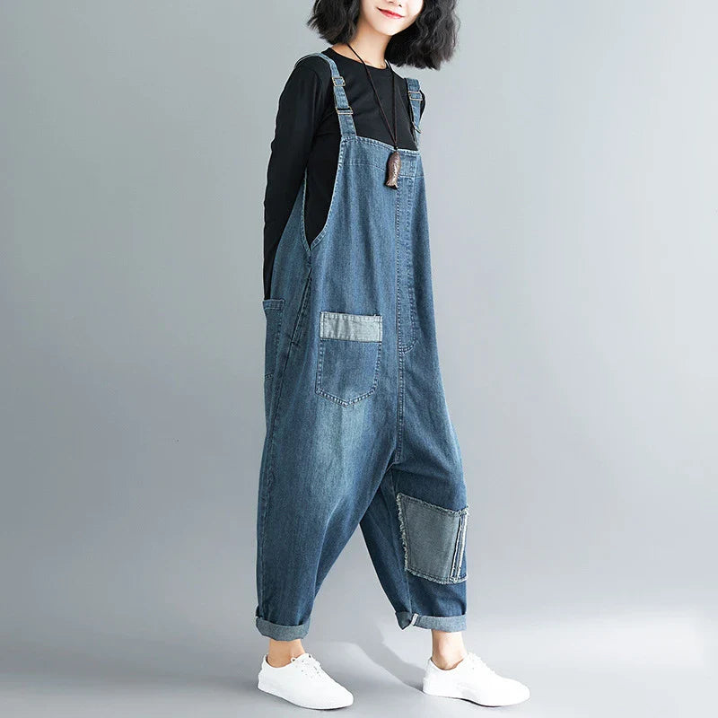 Premium, distressed denim overalls with a high-waisted fit and nine-inch leg length, designed for the modern Kiwi woman