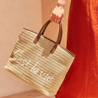 Stylish straw tote bag with trendy letter decoration, perfect for Kiwi women's casual summer style