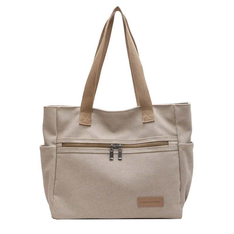 Trendha premium canvas shoulder bags in a range of classic colours, featuring a spacious main compartment and multiple internal pockets for ultimate organization and convenience.