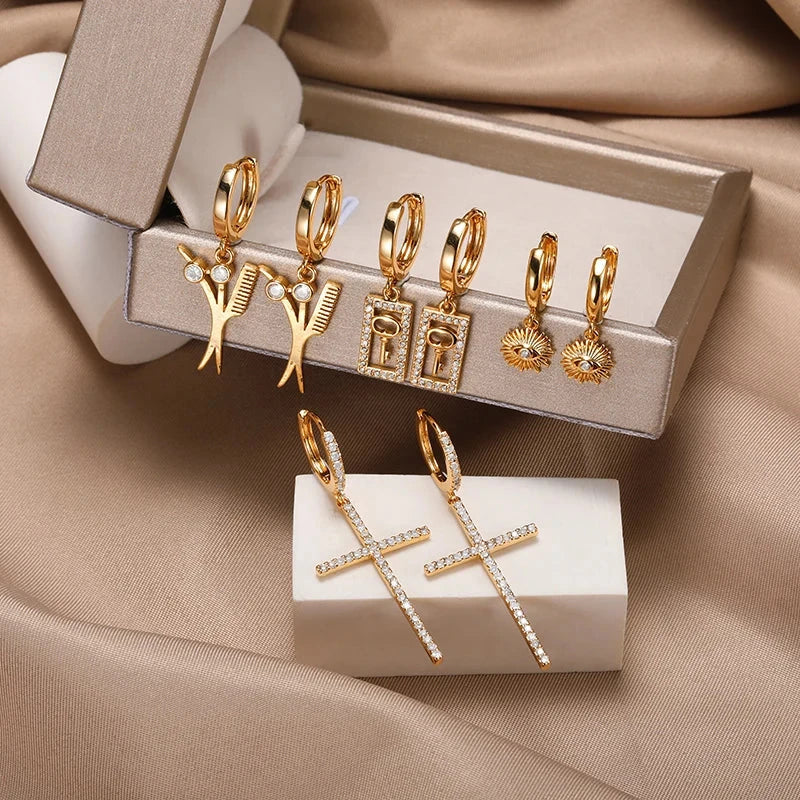 Elegant cross-shaped dangle earrings made with premium cubic zirconia and copper