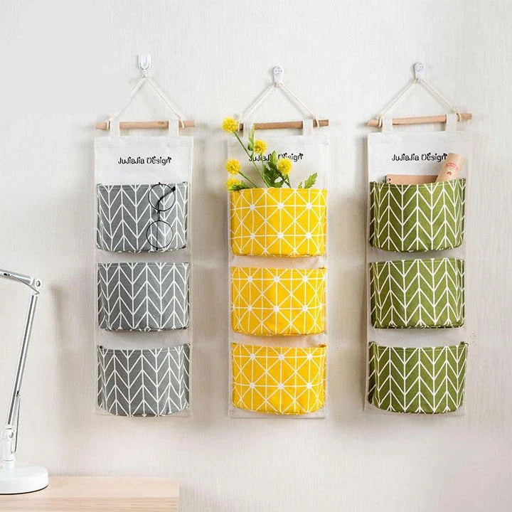 Versatile Hanging Organiser in green colour, featuring three storage pockets for tidy and organised home storage