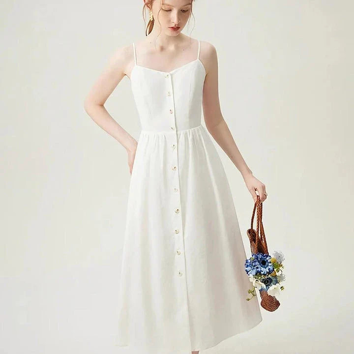 Sustainable Cozy Cotton and Linen Vacation Dress in a mid-calf length with a flattering empire waistline and spaghetti straps, perfect for Kiwi summers.