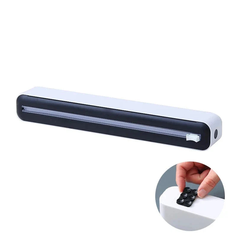 Versatile magnetic kitchen wrap dispenser with slide cutter for managing cling film, foil, and baking paper in a Kiwi kitchen