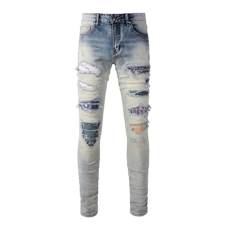 Stylish men's ripped jeans in light blue, featuring a unique distressed look and skinny-fit silhouette inspired by New Zealand's high-street fashion