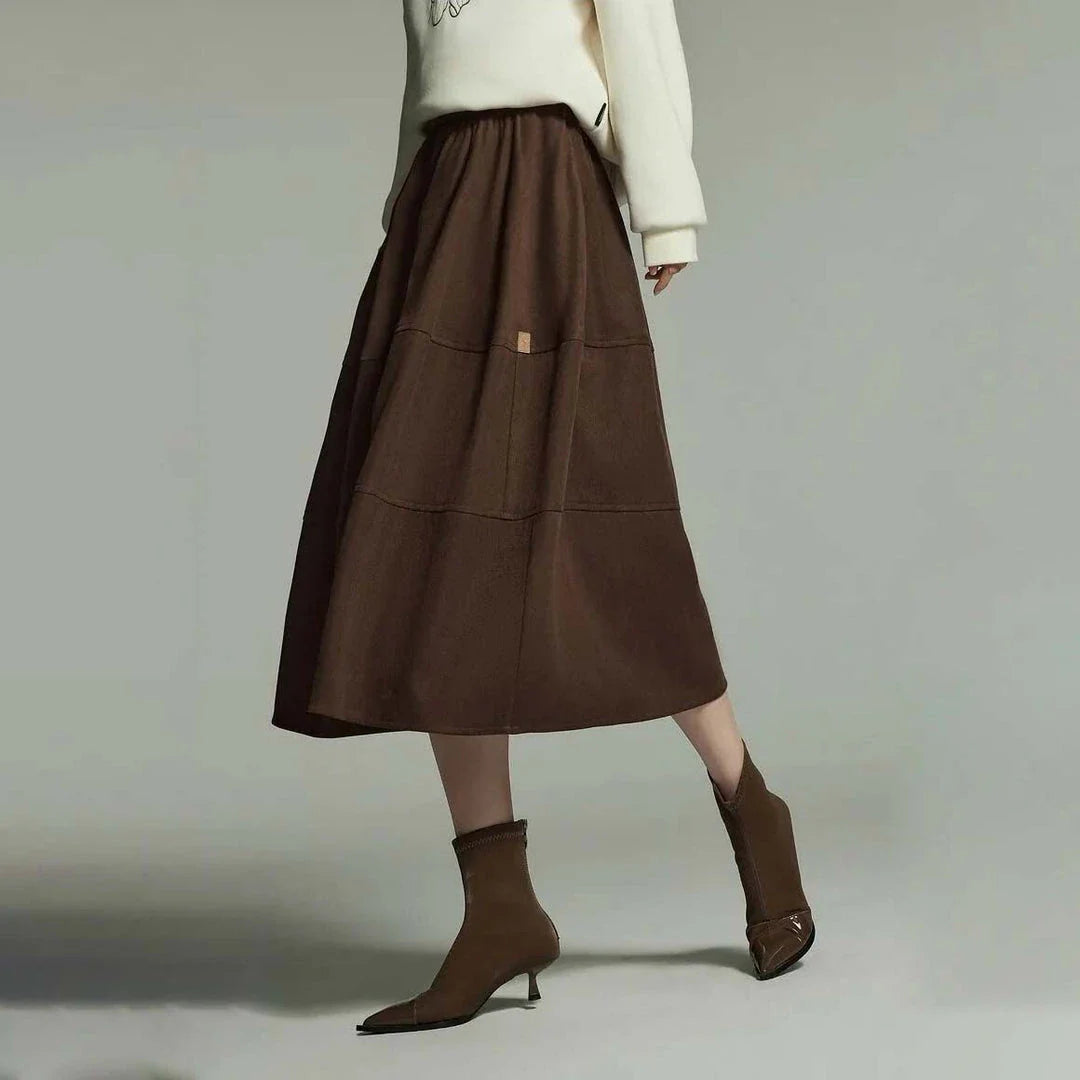 A stylish mid-length pleated skirt with pockets, perfect for winter wear in New Zealand