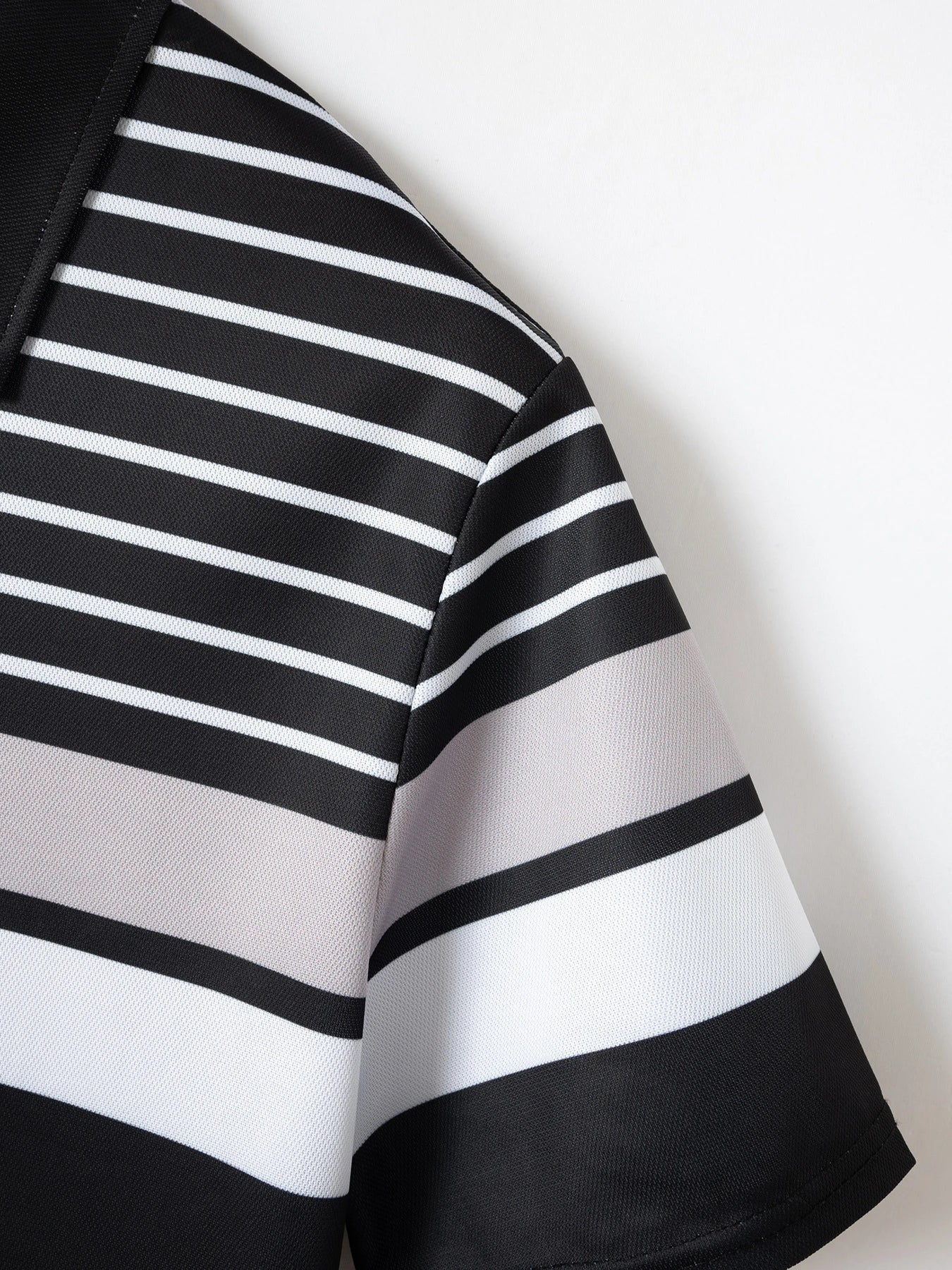 Versatile striped t-shirt in black, a premium Kiwi-made casual essential with a relaxed, comfortable fit