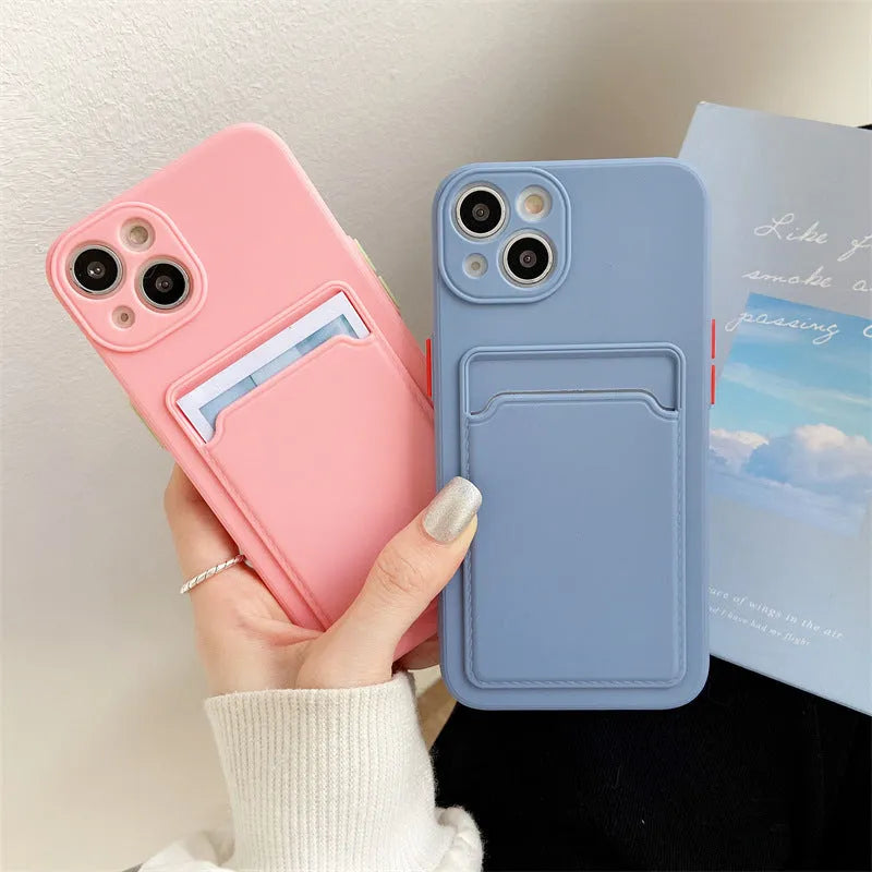 Sky blue silicone iPhone case with a card slot on the back for iPhone 16 and older models.
