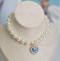 A decorative gem-style cat collar in plastic alloy resin, shown in multiple solid colours with adjustable sizing.