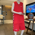 Men's grey polyester sleeveless basketball vest and matching shorts sports set laid flat