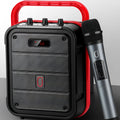 MS62AI portable Bluetooth speaker with wireless microphone on a table, showing control buttons and volume knob.