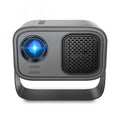 Black portable HD projector with remote control on desk