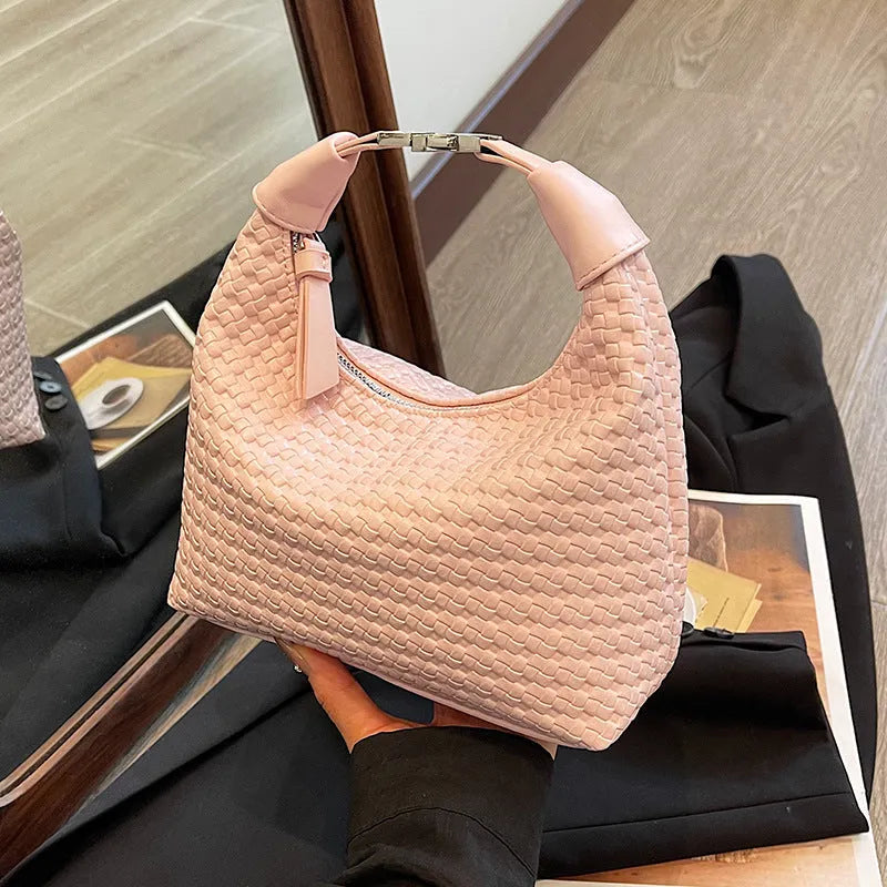 Soft PU leather messenger bag in bucket shape with internal document compartment, shown in a choice of colours.