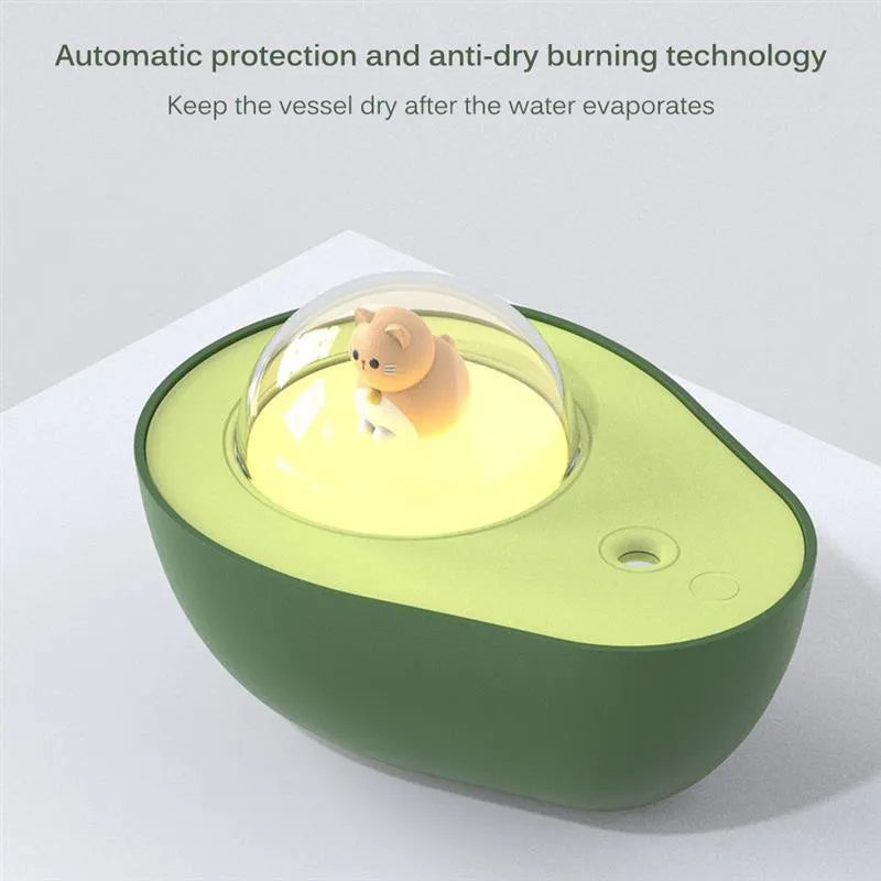 Green avocado-shaped mini USB humidifier with night light on a desk