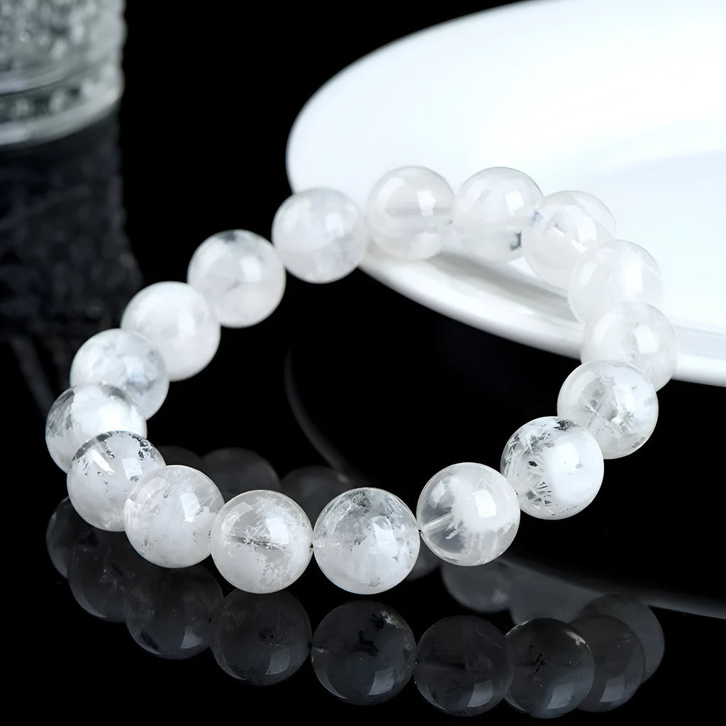 Crystal women's bracelet with natural blizzard snowflake round beads in geometric shapes showing traditional Ruyi and Xiangyun motifs