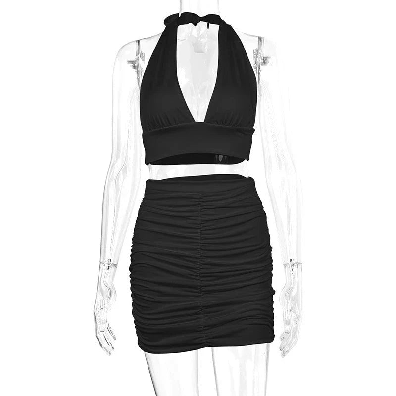 Stylish 2-piece dress set for women featuring a halter top with lace-up detail and a pleated skirt in various colors