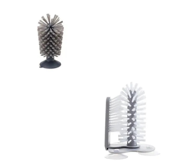 Grey rotating cup brush with two suction cups for wall mounting, shown cleaning a glass
