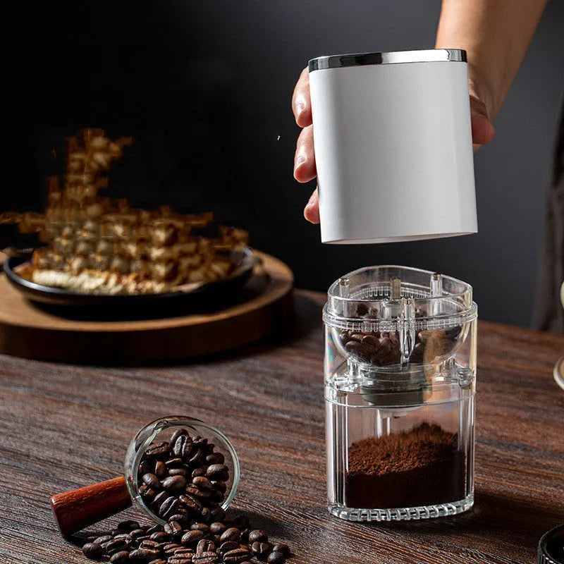 Frosted white portable electric coffee grinder with ceramic burr and USB-C charging port.