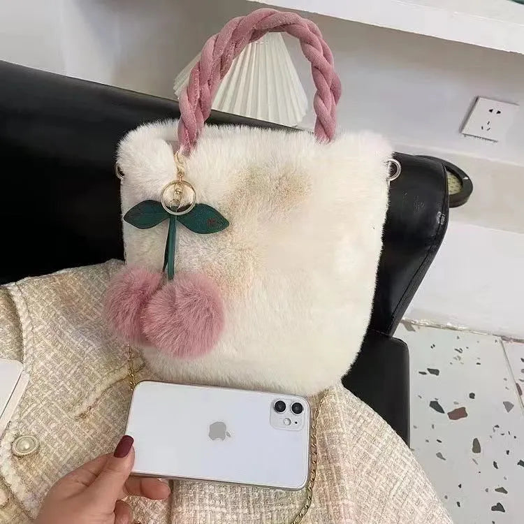 Large soft plush travel bucket bag in beige with open pocket and single shoulder strap