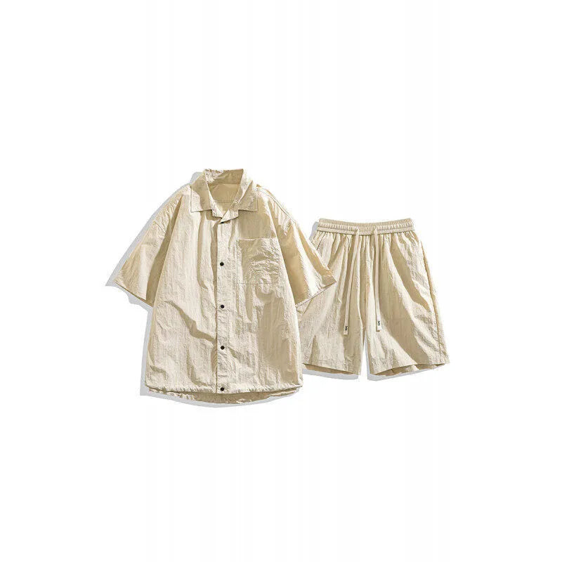 Man wearing a loose dark grey hemp-blend shirt and matching shorts casual two-piece set.